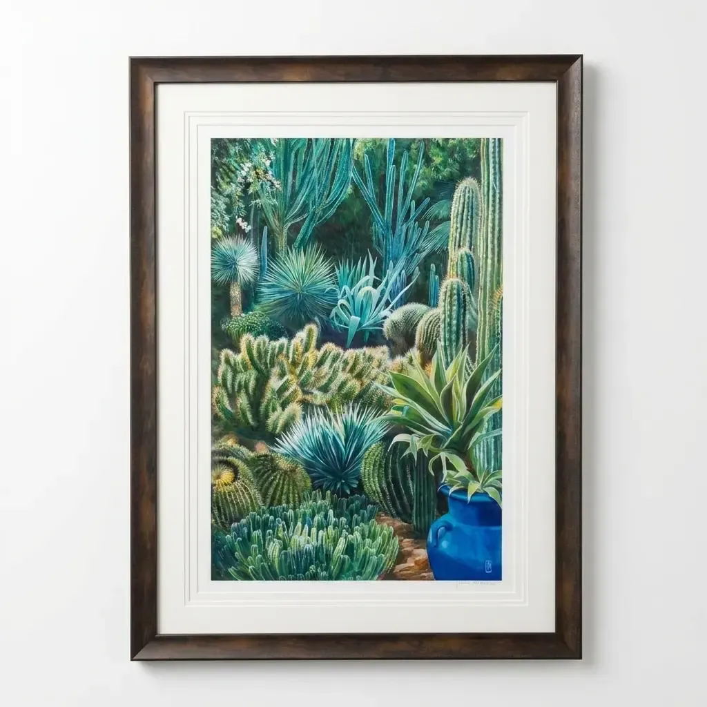 A painting of a cactus garden in an ornate dark wood frame with a white mount