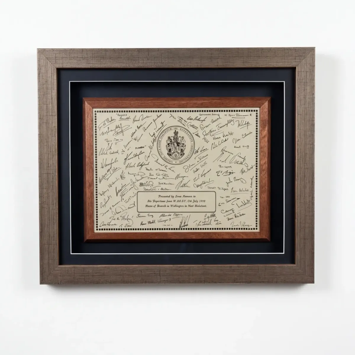 A signed presentation certificate, double mounted in a wide frame